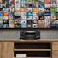 Onkyo TXRZ50 AV receiver under TV sitting on wooden dresser